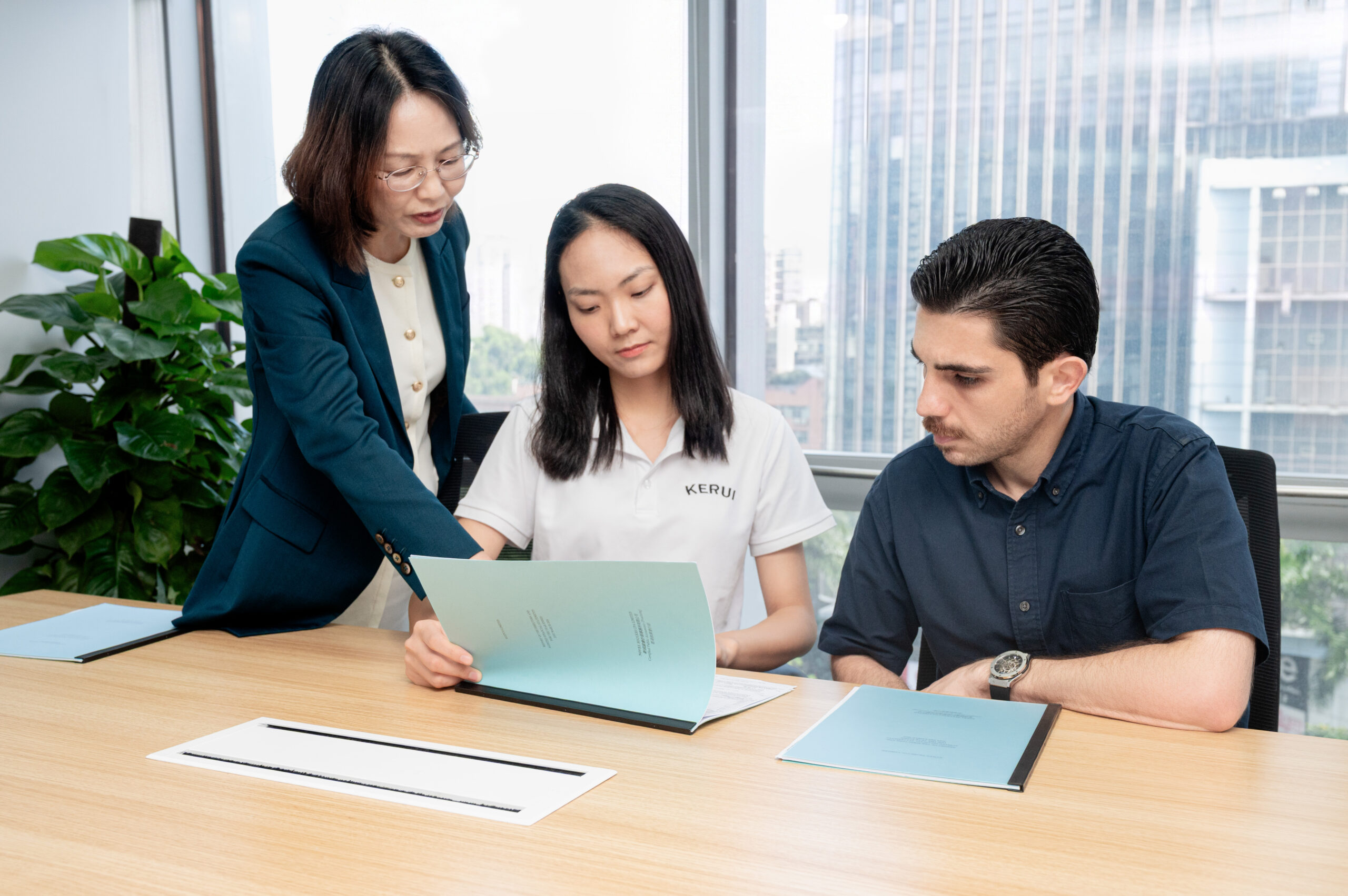Consultant organizing a KYC preparation folder with business proof documents neatly arranged before a bank meeting