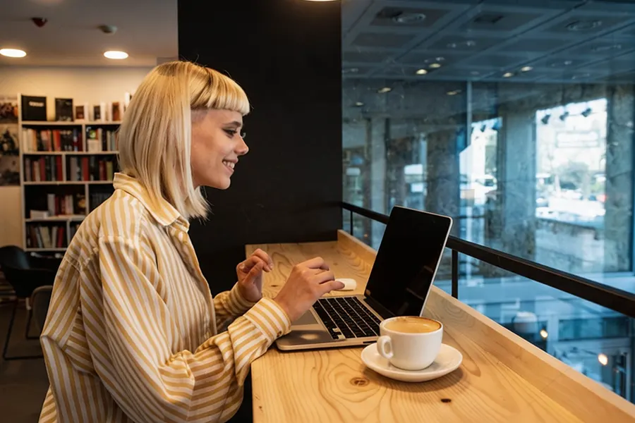 Long-term expat at a driving license exchange counter presenting an overseas driving license and a passport