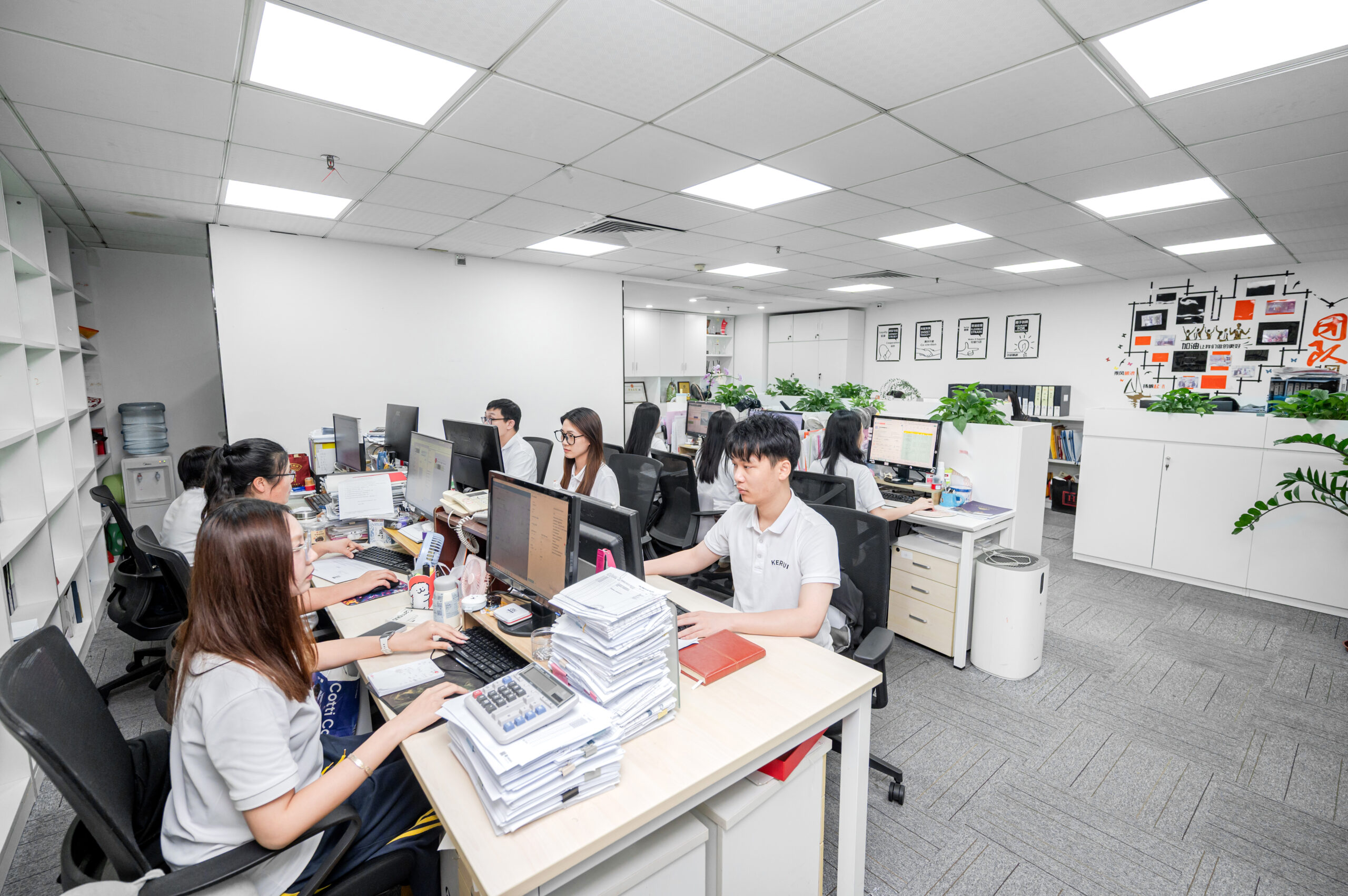 Foreign residents in China reviewing residence and expat service documents with a consultant